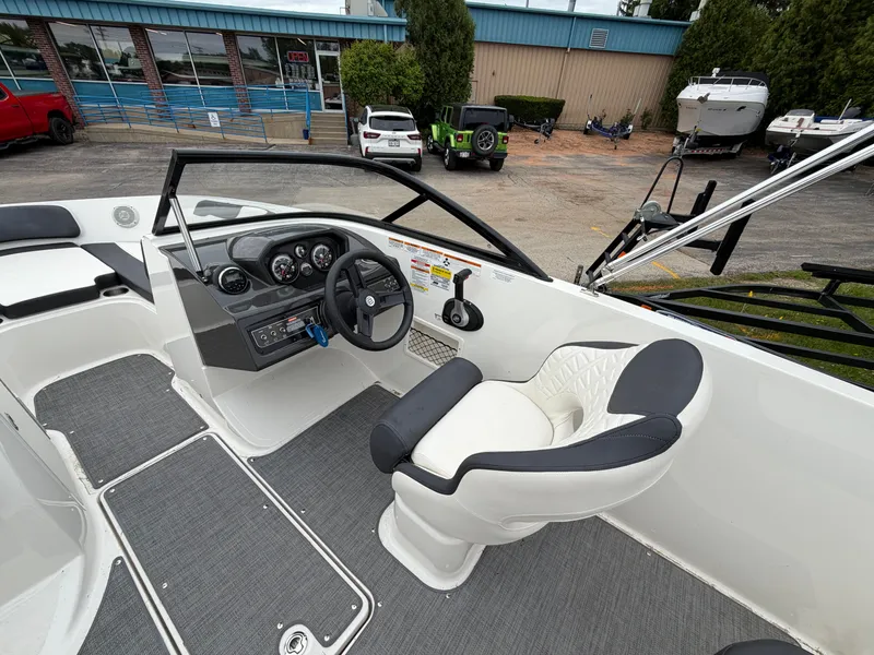 Slide: The Image of Interior of a 2019 Bayliner V45 boat with steering console. - 18