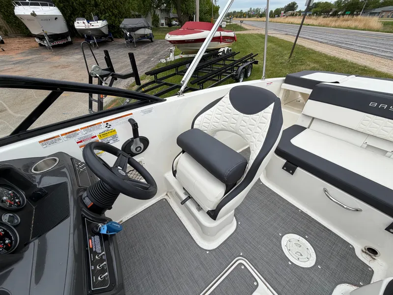 Slide: The Image of Interior of a 2019 Bayliner V45 boat with steering and seating. - 19