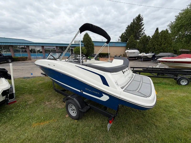 Slide: The Image of 2019 Bayliner V45 boat on trailer, blue and white design. - 2