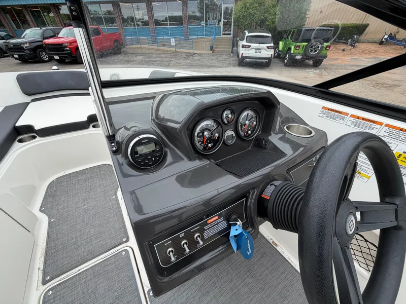 Slide: The Image of Dashboard of a 2019 Bayliner V45 boat with steering wheel and gauges. - 20