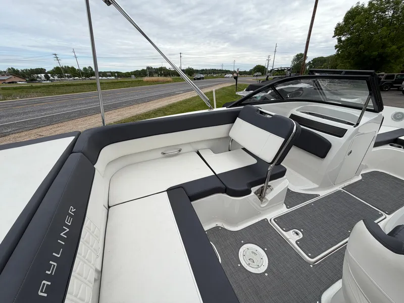Slide: The Image of Interior of a 2019 Bayliner V45 boat with gray and white seating. - 24
