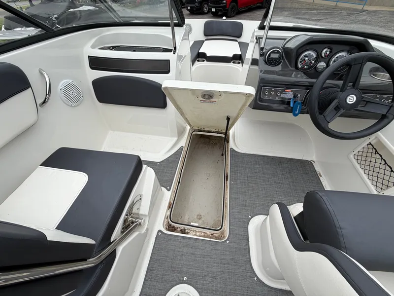 Slide: The Image of Interior of a 2019 Bayliner V45 boat with open storage compartment. - 28