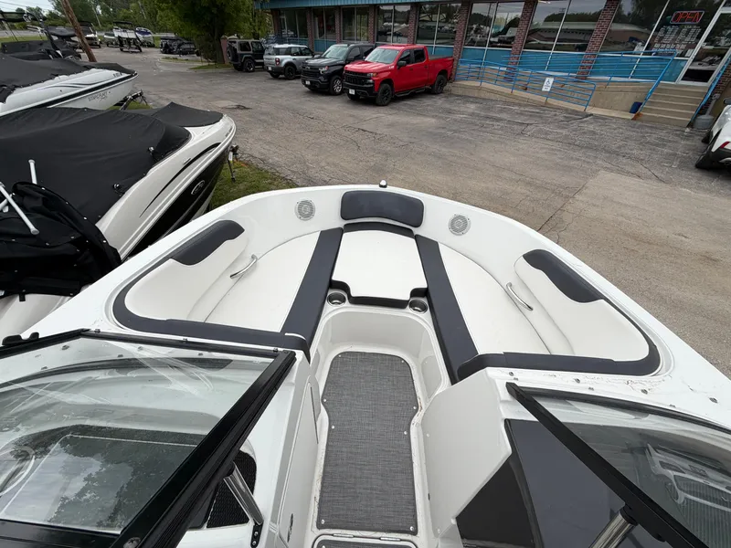 Slide: The Image of 2019 Bayliner V45 boat with open cabin and seating area. - 29