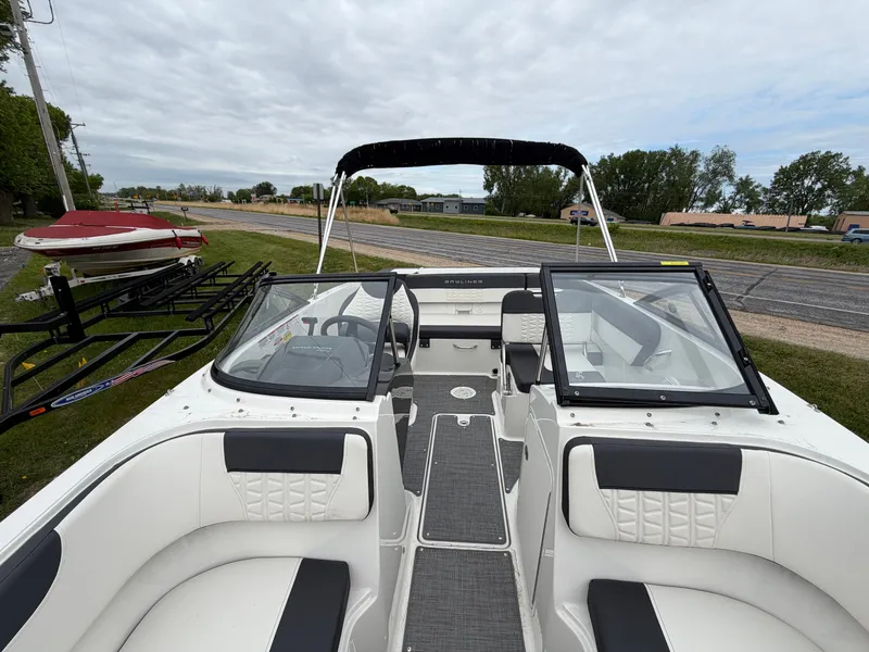 Slide: The Image of Interior view of a 2019 Bayliner V45 boat with open canopy. - 30