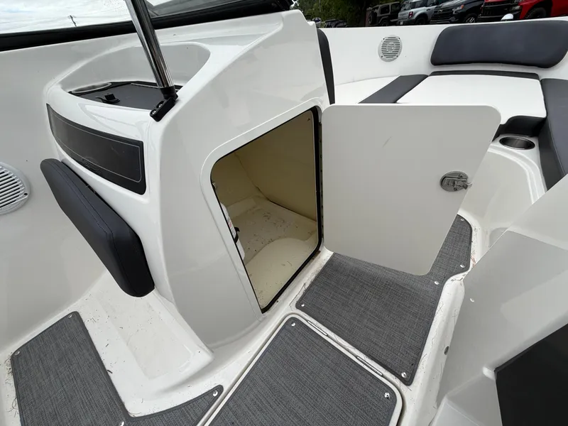 Slide: The Image of Interior of 2019 Bayliner V45 with open storage compartment door. - 31