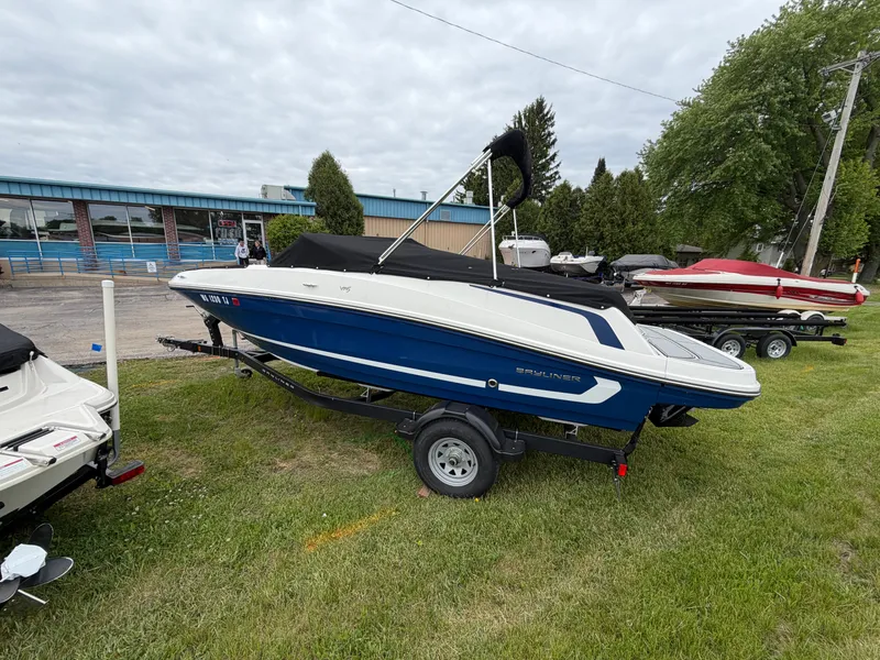Slide: The Image of 2019 Bayliner V45 boat on trailer, blue and white, parked outdoors. - 6
