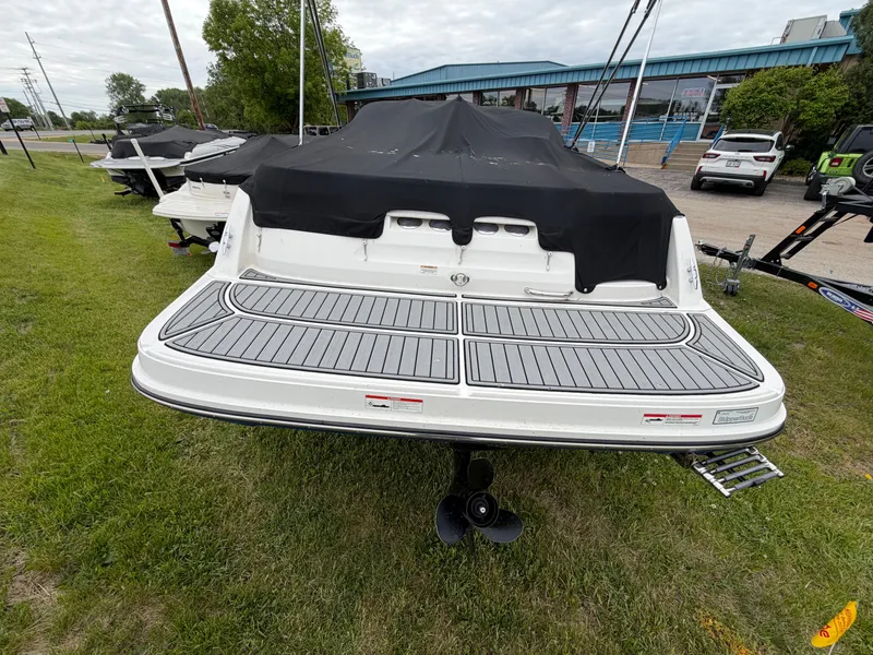 Slide: The Image of Rear view of a 2019 Bayliner V45 boat on grass. - 8
