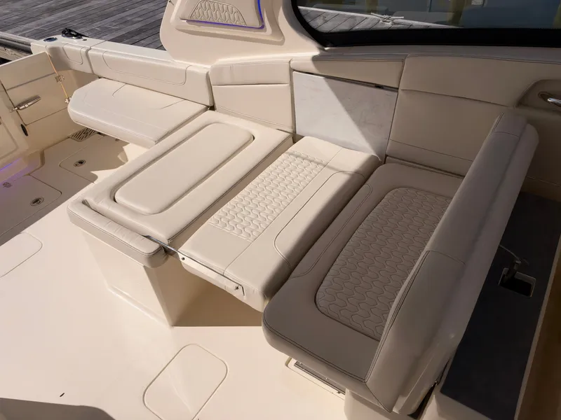 Slide: The Image of The 2027 Scout 288 Dorado features a luxurious cream-colored seating area with elegant detailing. - 23
