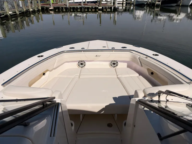 Slide: The Image of The 2027 Scout 288 Dorado features a spacious, cushioned seating area at the bow, perfect for relaxing. - 45