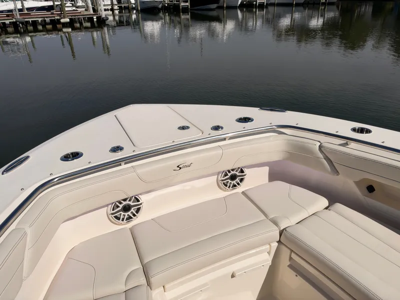 Slide: The Image of The 2027 Scout 288 Dorado features a spacious, cushioned seating area at the bow. - 48