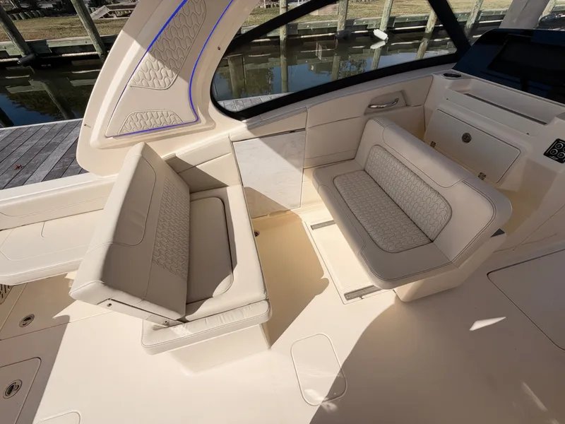 Slide: The Image of Interior view of a Scout 288 Dorado with beige upholstery and sleek details. - 21