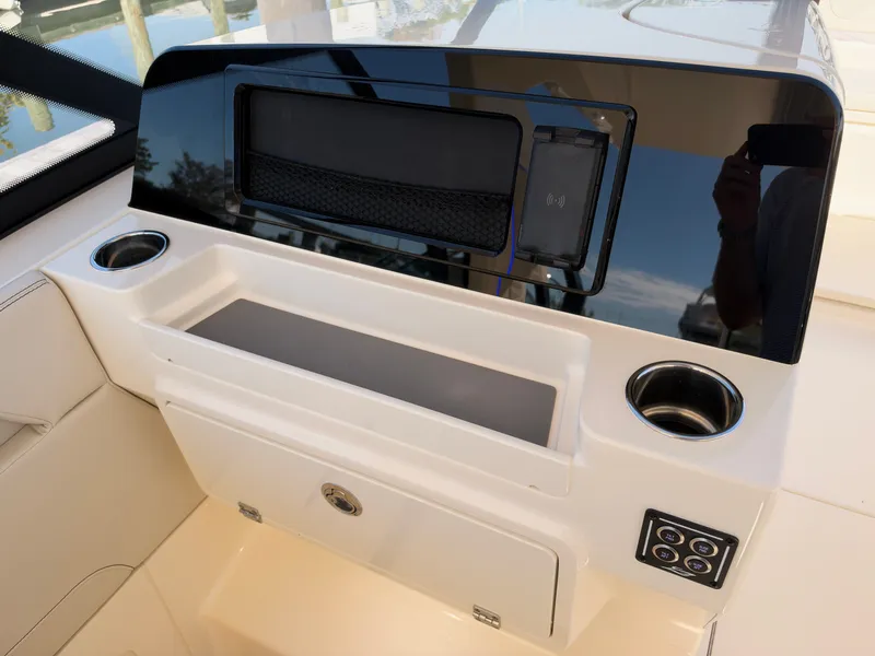 Slide: The Image of The image shows the cockpit of a 2027 Scout 288 Dorado with cup holders and controls. - 35
