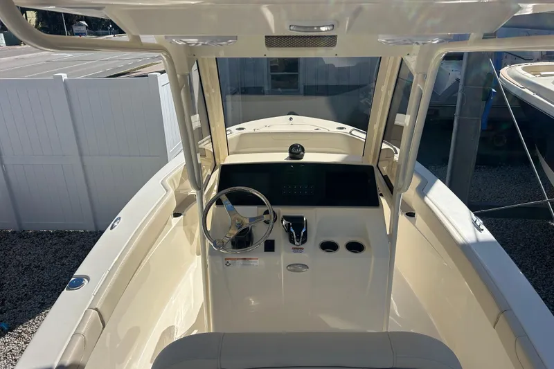 Slide: The Image of 2026 Scout 220 XSF boat cockpit with steering wheel and control panel. - 11