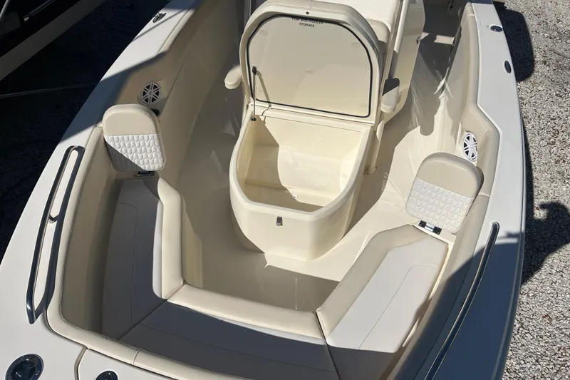 Slide: The Image of 2026 Scout 220 XSF boat interior with seating and storage compartments. - 17
