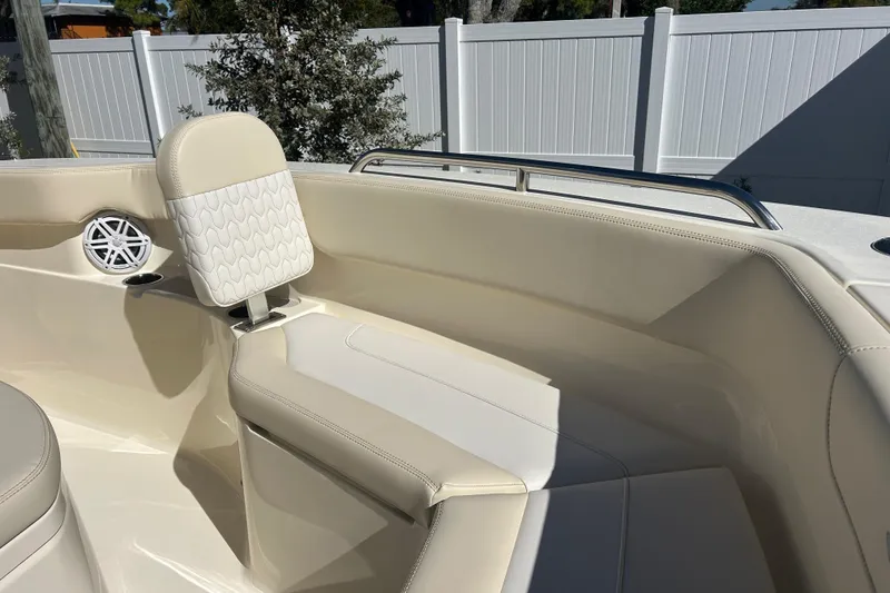 Slide: The Image of 2026 Scout 220 XSF boat interior with beige seating and speaker detail. - 19
