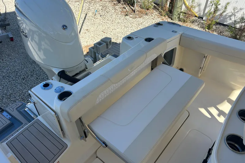 Slide: The Image of 2026 Scout 220 XSF boat interior with seating and Yamaha outboard motor. - 9