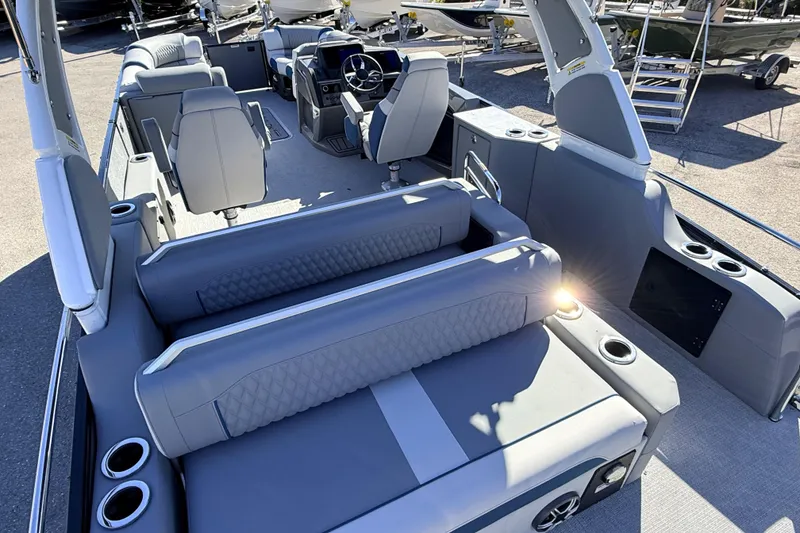 Slide: The Image of 2026 Avalon 2585 Excalibur LTD Flex Lounge, Tri Toon boat interior with luxurious seating. - 12
