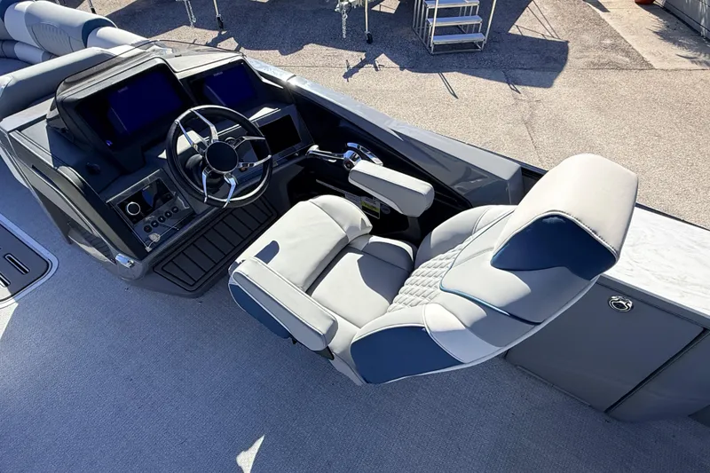 Slide: The Image of Luxurious helm of 2026 Avalon 2585 Excalibur LTD Flex Lounge boat, featuring advanced controls. - 14