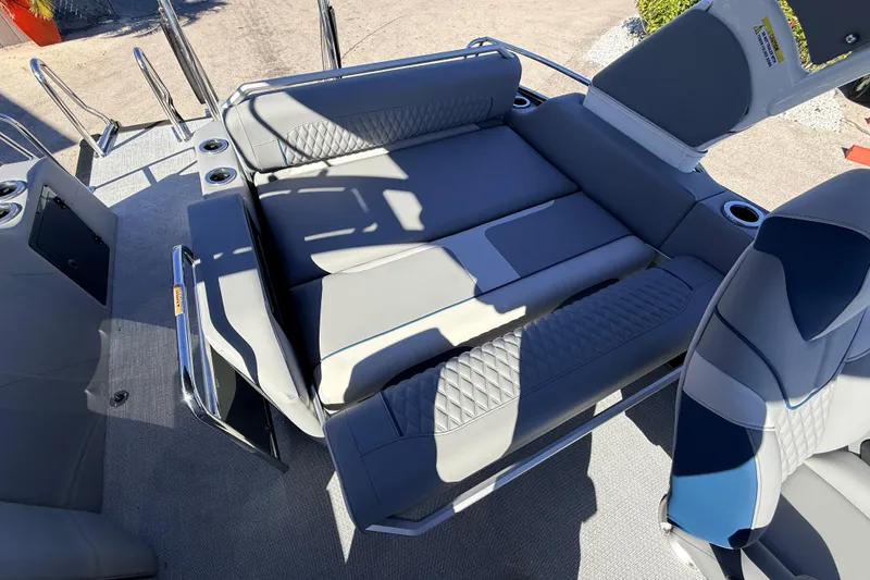 Slide: The Image of 2026 Avalon 2585 Excalibur LTD Flex Lounge interior with luxurious seating and cup holders. - 27