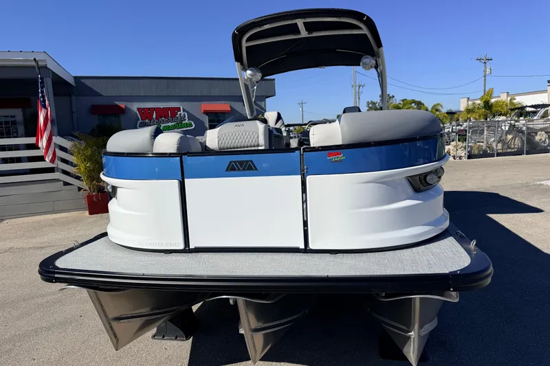 Slide: The Image of 2026 Avalon 2585 Excalibur LTD Flex Lounge Tri Toon boat, high performance, parked outdoors. - 4
