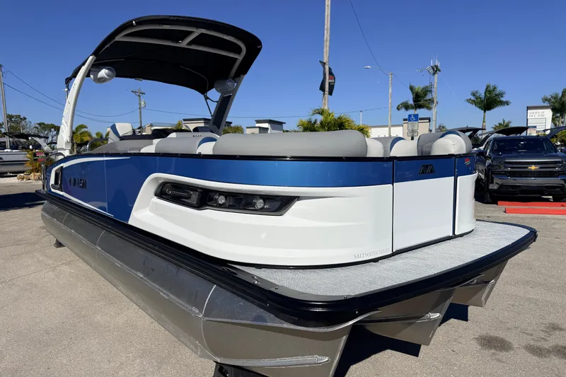 Slide: The Image of 2026 Avalon 2585 Excalibur LTD Flex Lounge Tri Toon boat, high performance, parked outdoors. - 5