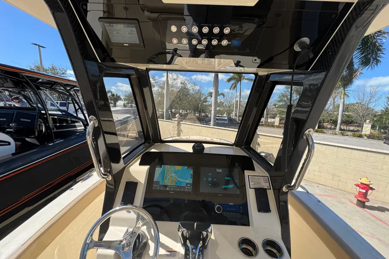 Slide: The Image of Interior view of 2025 Scout 260 LXF boat cockpit with navigation system. - 18