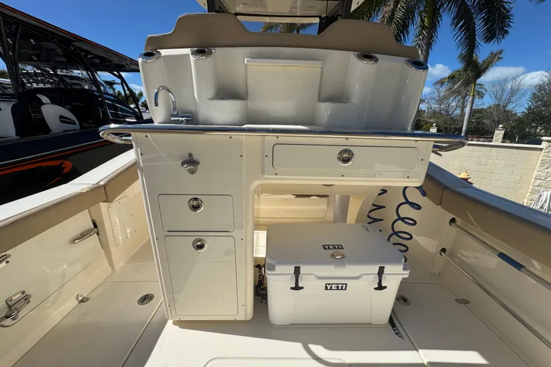 Slide: The Image of 2025 Scout 260 LXF boat interior with Yeti cooler and storage compartments. - 24