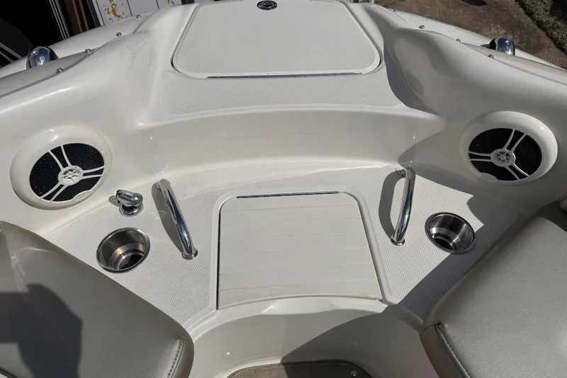 Slide: The Image of 2006 Sea Ray 240 Sundeck boat interior with speakers and cup holders. - 27