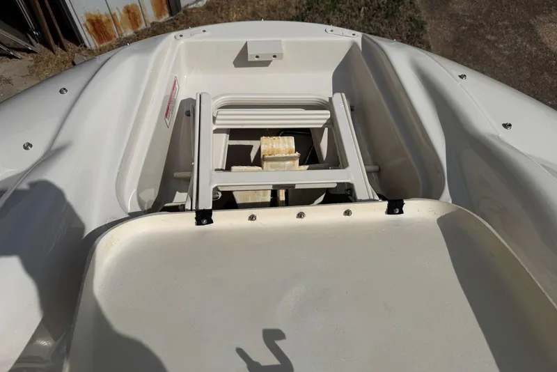 Slide: The Image of 2006 Sea Ray 240 Sundeck boat ladder compartment, open and exposed. - 28