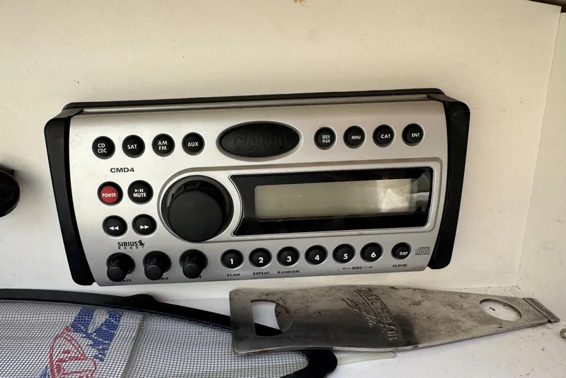 Slide: The Image of Clarion CMD4 marine stereo on 2006 Sea Ray 240 Sundeck boat dashboard. - 35