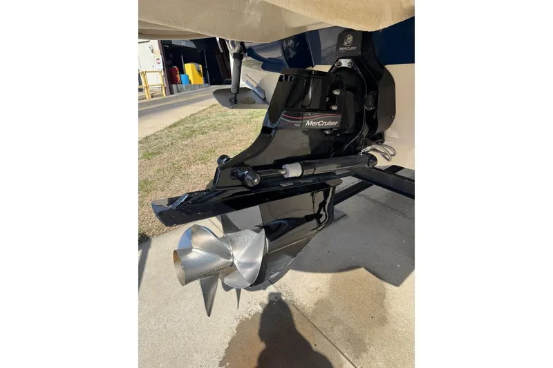 Slide: The Image of 2006 Sea Ray 240 Sundeck with MerCruiser outdrive, showcasing propeller and engine details. - 45