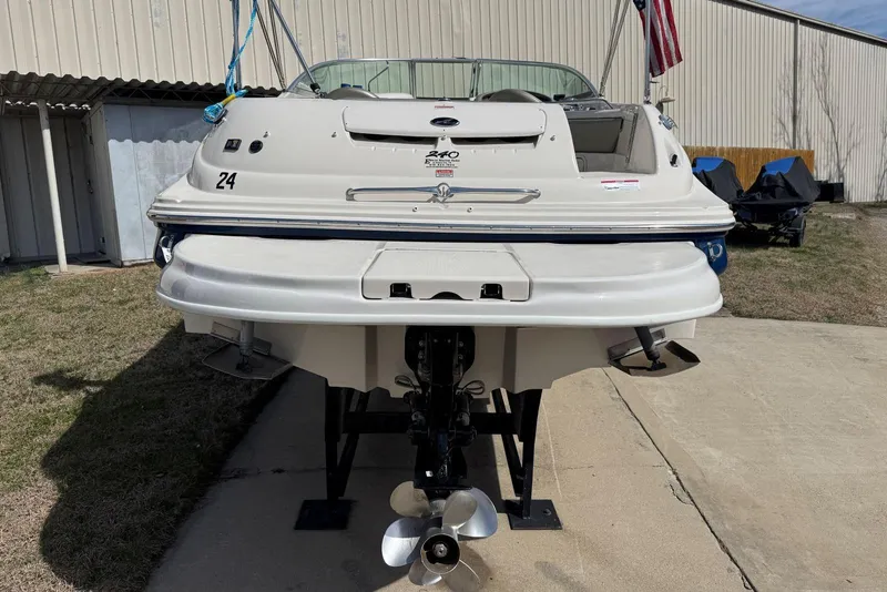 Slide: The Image of 2006 Sea Ray 240 Sundeck boat on display, rear view with propeller visible. - 5