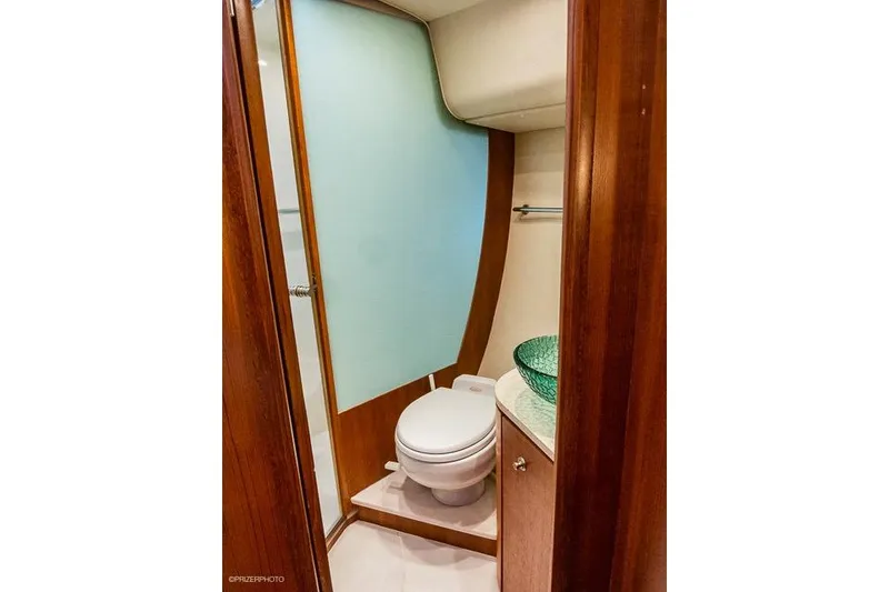 Slide: The Image of 2007 Tiara Yachts 4300 Sovran bathroom with modern design and glass sink. - 13