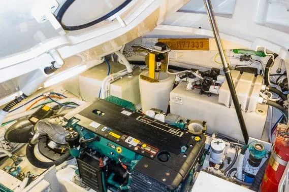 Slide: The Image of Engine room of 2007 Tiara Yachts 4300 Sovran, showcasing mechanical components and systems. - 14