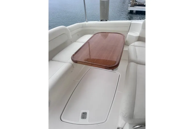 Slide: The Image of Luxurious seating area on 2006 Tiara Yachts 4300 Sovran with wooden table. - 19