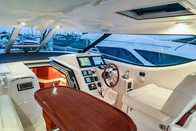 Slide: The Image of Interior of 2007 Tiara Yachts 4300 Sovran, featuring helm and seating area. - 3