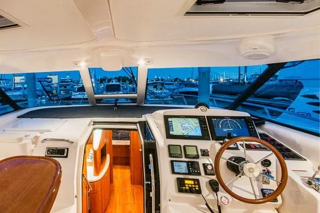 Slide: The Image of 2007 Tiara Yachts 4300 Sovran helm with advanced navigation systems and luxurious interior view. - 4