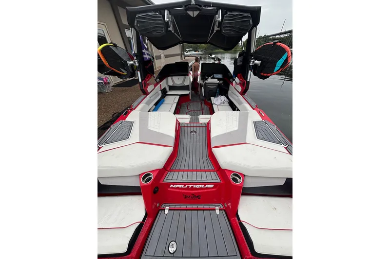 Slide: The Image of 2023 Nautique Super Air Nautique G23 boat interior with red and white seating. - 5