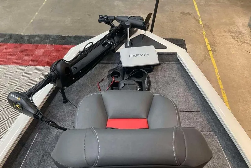 Slide: The Image of 2025 Tracker Pro Team 175 boat interior with Garmin navigation system and trolling motor. - 12