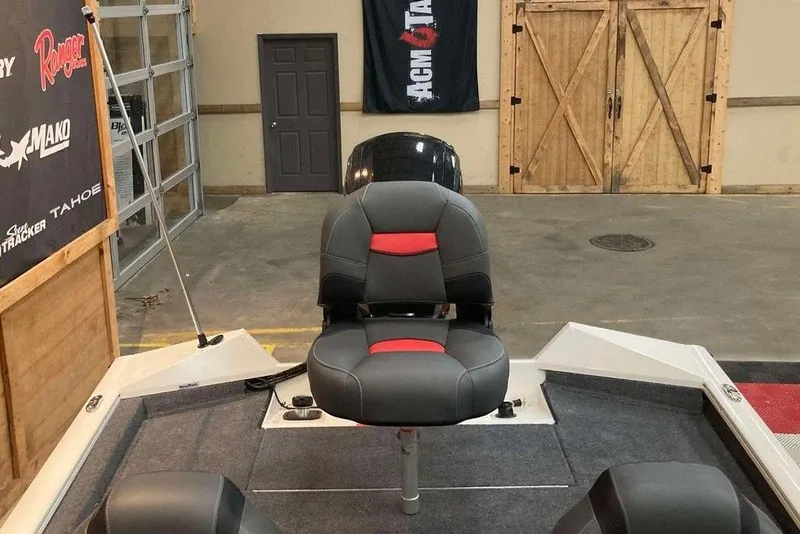 Slide: The Image of 2025 Tracker Pro Team 175 boat interior with seating in a showroom setting. - 13