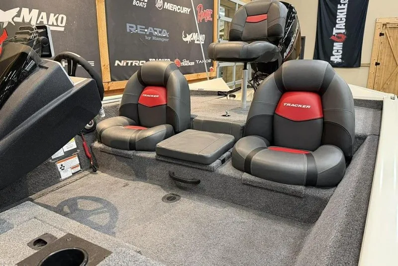 Slide: The Image of 2025 Tracker Pro Team 175 boat interior with gray and red seating. - 17