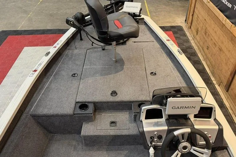 Slide: The Image of 2025 Tracker Pro Team 175 boat interior with Garmin electronics and seating. - 9