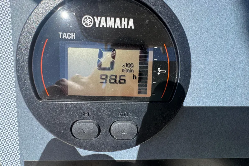 Slide: The Image of Yamaha tachometer displaying 98.6 hours on a 2023 Scout 195 Sportfish boat. - 15