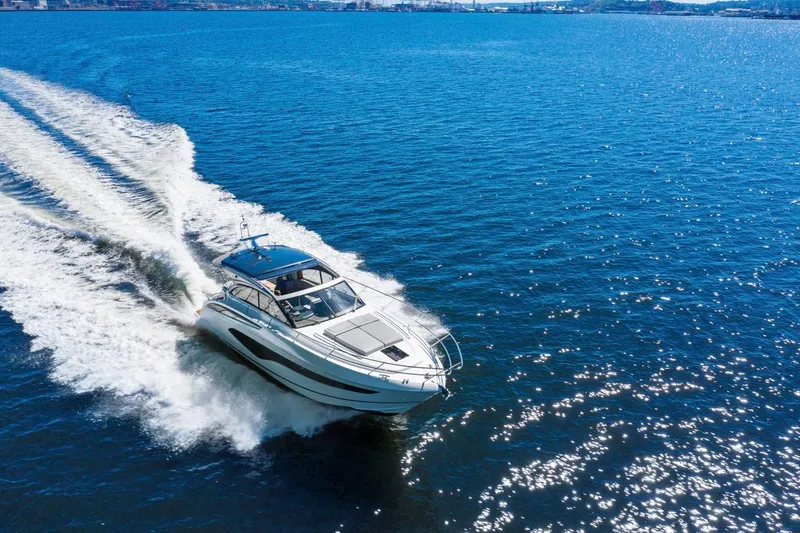 Slide: The Image of 2020 Princess V50 yacht cruising on open sea. - 2