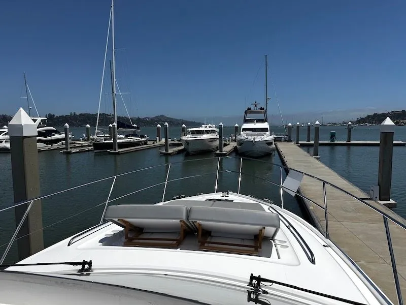 Slide: The Image of 2020 Princess V50 yacht docked in marina under sunny skies. - 24