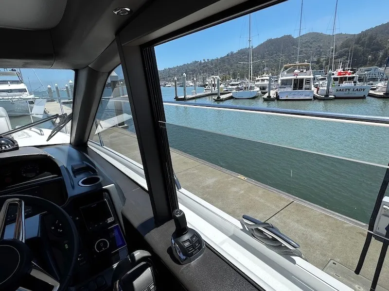 Slide: The Image of View from the cockpit of a Princess V50 overlooking a marina with several boats docked. - 21