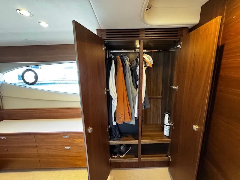 Slide: The Image of Open wardrobe on a 2020 Princess V50 yacht. - 44