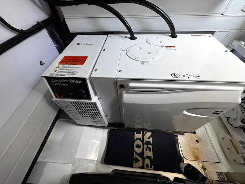 Slide: The Image of Cummins Onan generator in the engine room of a Princess V50 yacht. - 49