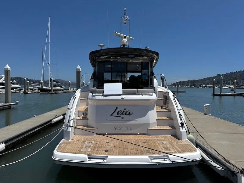 Slide: The Image of Rear view of a 2020 Princess V50 yacht at the dock. - 5