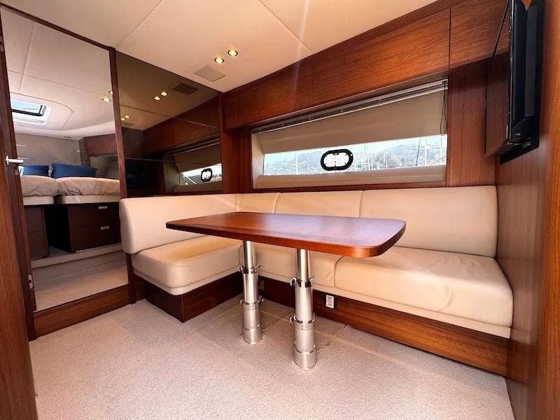 Slide: The Image of Interior of a luxury yacht with elegant wood finish and beige leather seating. - 27